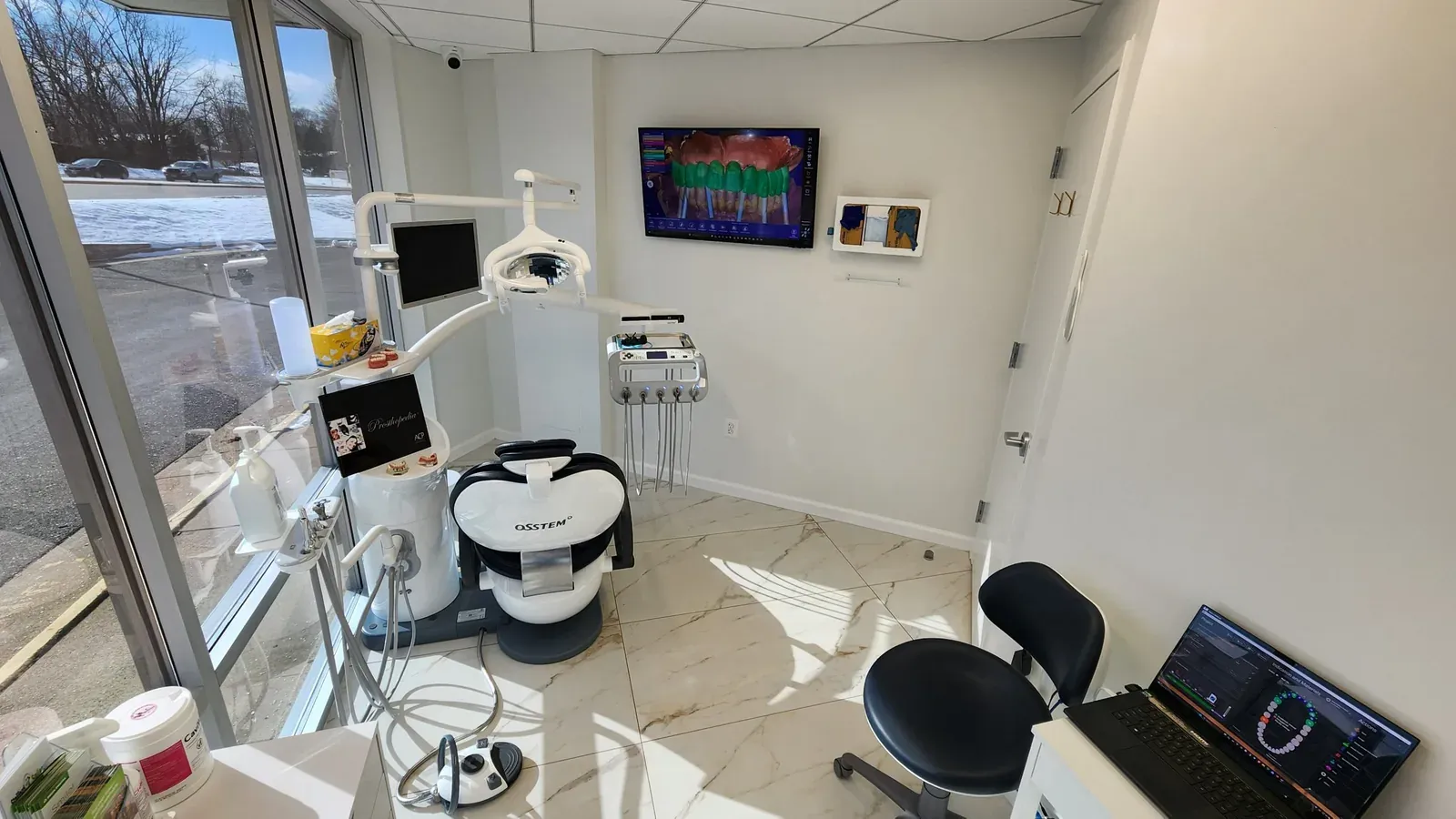 A treatment room with dental imaging equipment